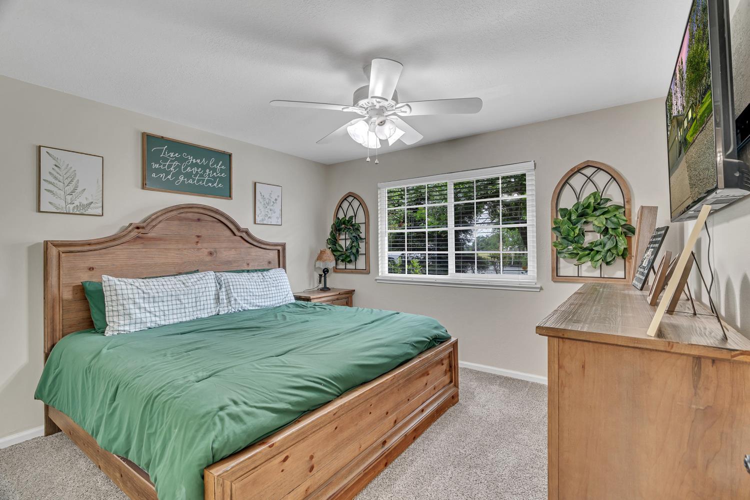 12354 Hobday Road Wilton, CA 95693 - Photo 52 of 77 bedroom with light carpet and a ceiling fan
