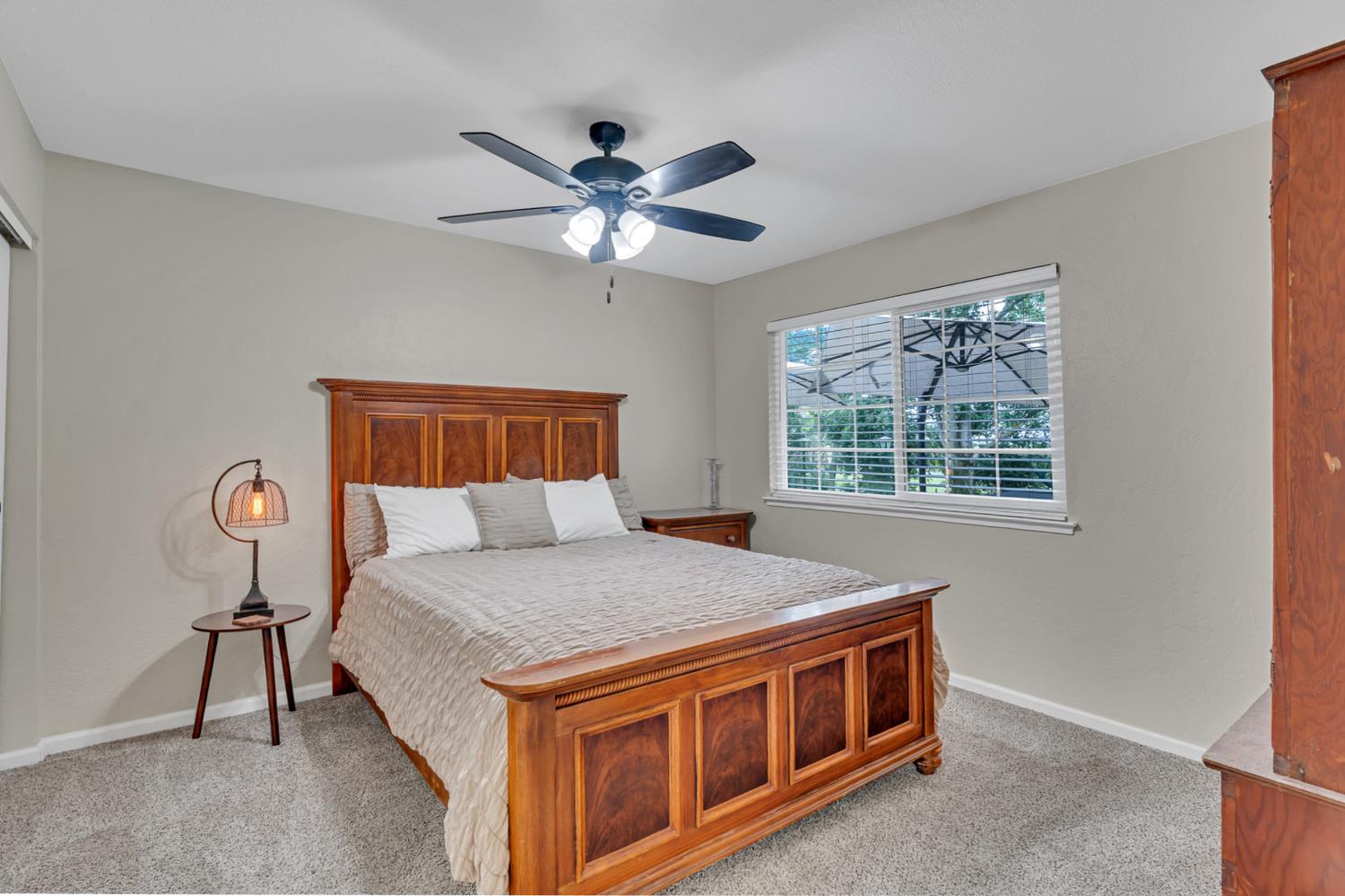 12354 Hobday Road Wilton, CA 95693 - Photo 53 of 77 bedroom with light colored carpet and a ceiling fan