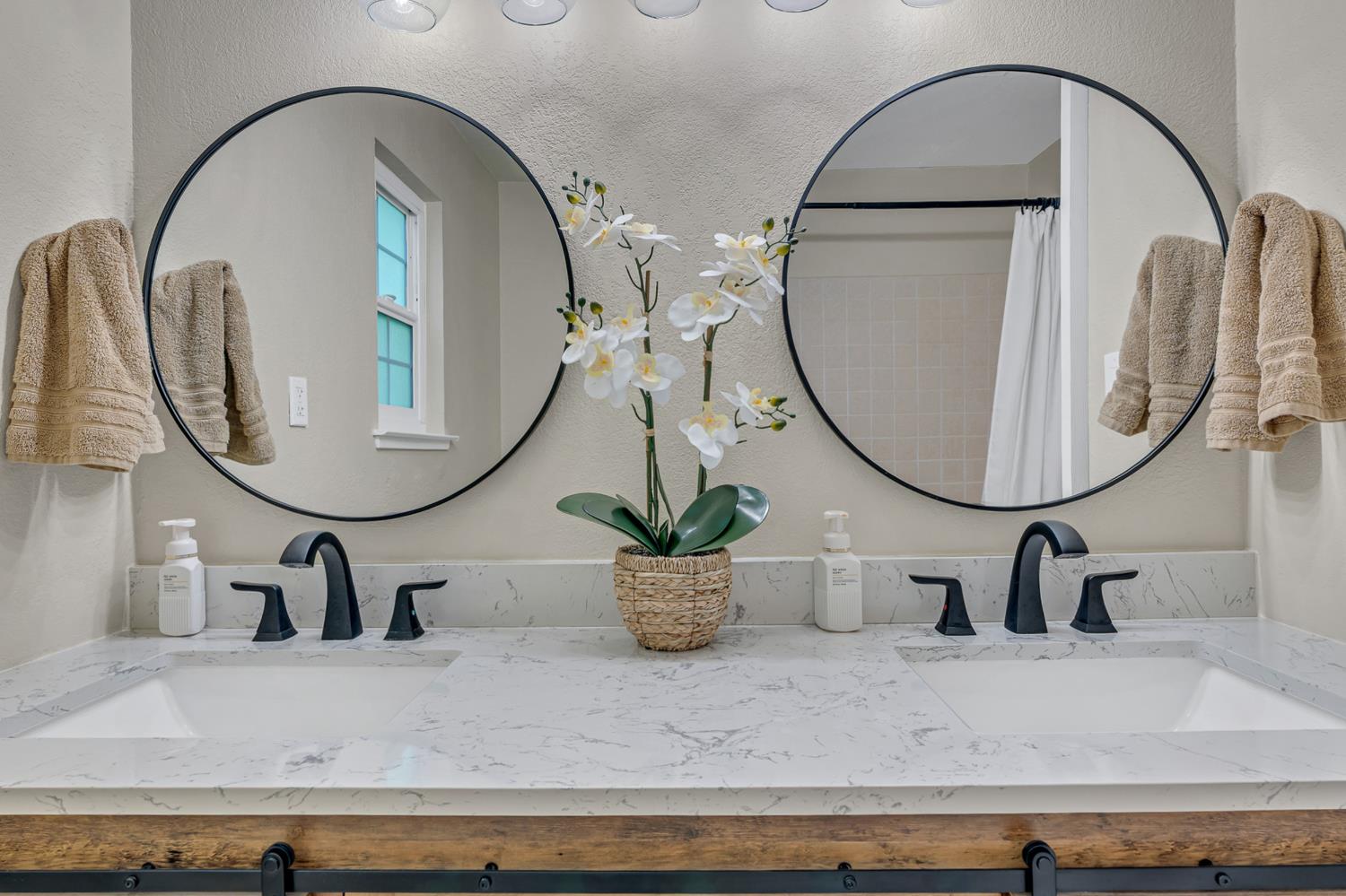 12354 Hobday Road Wilton, CA 95693 - Photo 55 of 77 full bath featuring double vanity, a textured wall, and curtained shower