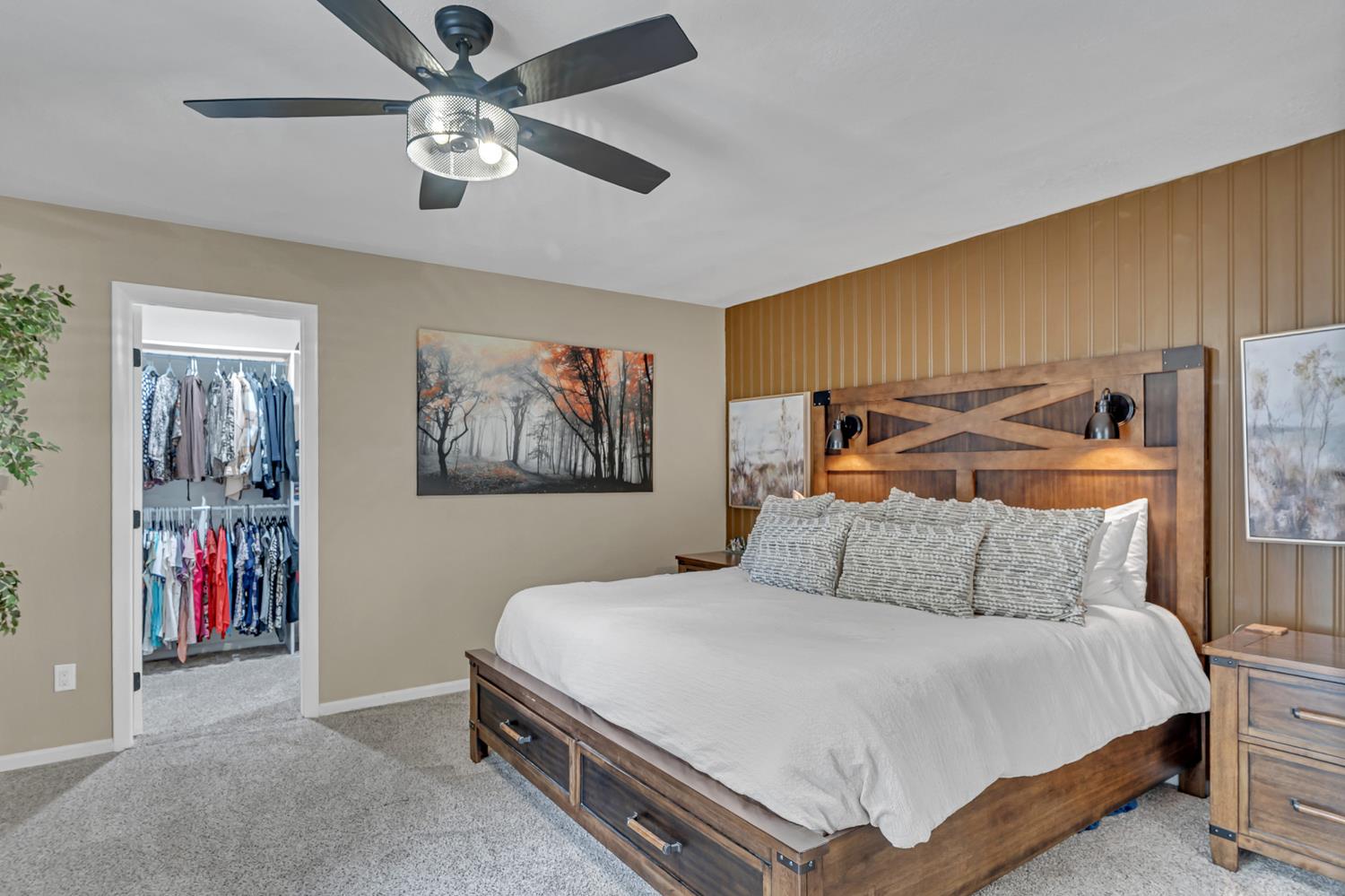 12354 Hobday Road Wilton, CA 95693 - Photo 56 of 77 bedroom with light colored carpet, a spacious closet, ceiling fan, and an accent wall