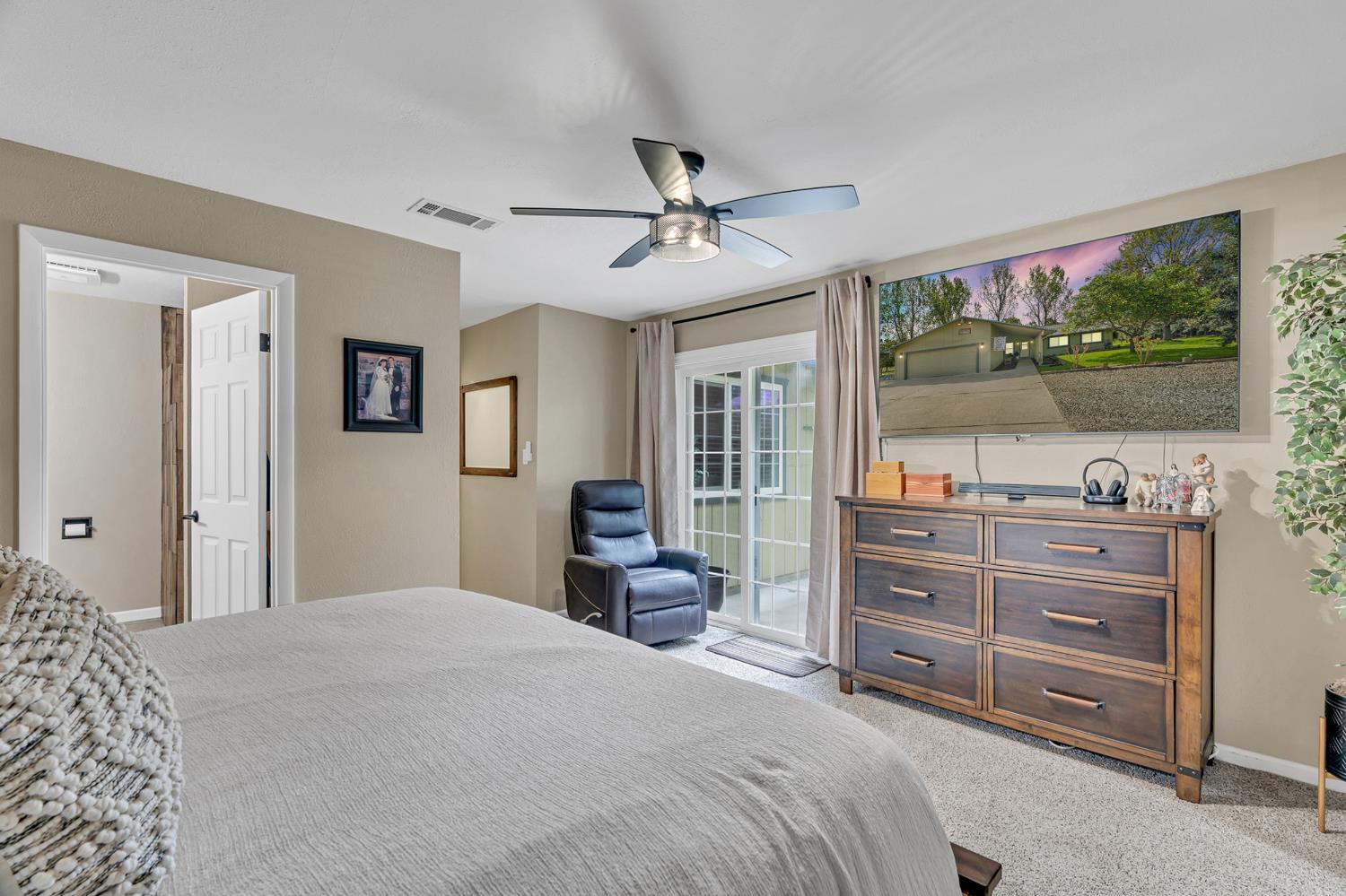 12354 Hobday Road Wilton, CA 95693 - Photo 58 of 77 bedroom featuring light colored carpet, ceiling fan, and access to outside