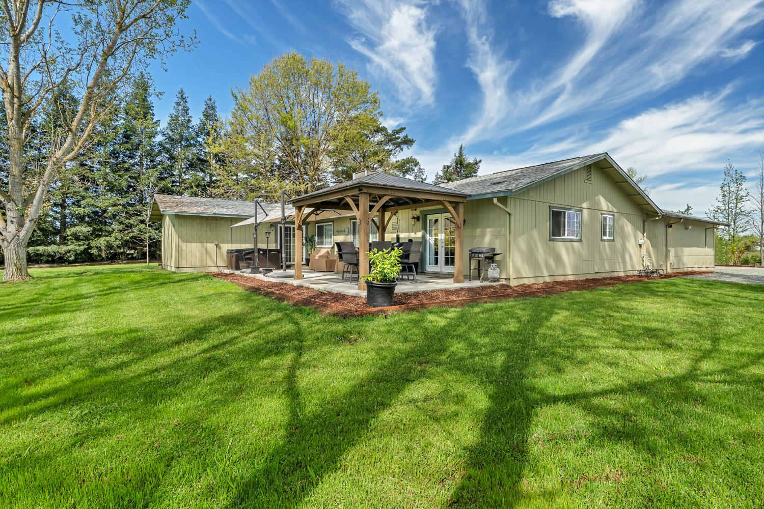 12354 Hobday Road Wilton, CA 95693 - Photo 8 of 77 rear view of house featuring a patio, a lawn, a gazebo, and an outdoor structure