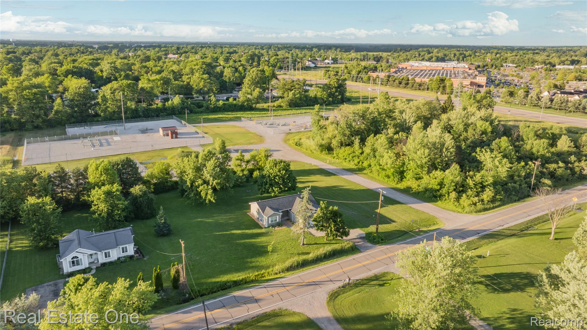 2479 Gibson Road Grand Blanc, MI 48439 - Photo 8 of 55 Expansive aerial capturing multiple properties amidst lush green landscapes
