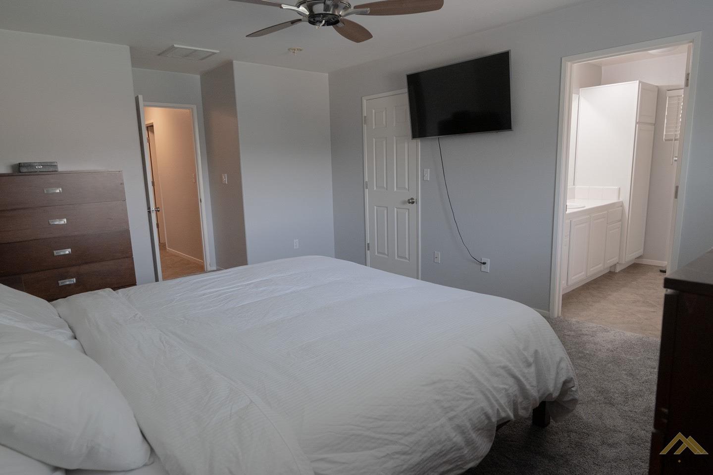 Undisclosed Address Bakersfield, CA 93312 - Photo 11 of 21 a bedroom with a bed and a flat screen tv