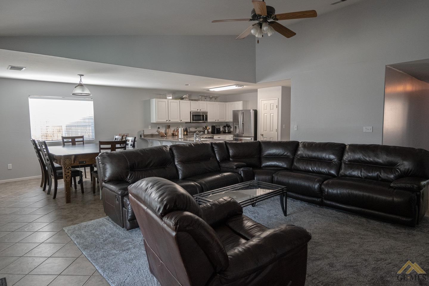 Undisclosed Address Bakersfield, CA 93312 - Photo 2 of 21 a media room with lots of chairs and a projector screen