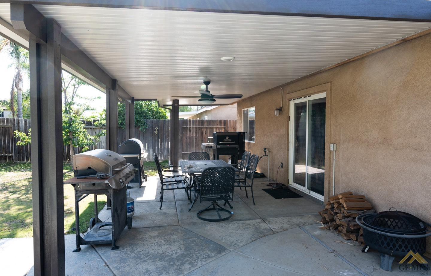 Undisclosed Address Bakersfield, CA 93312 - Photo 21 of 21 a view of a patio with table and chairs and potted plants