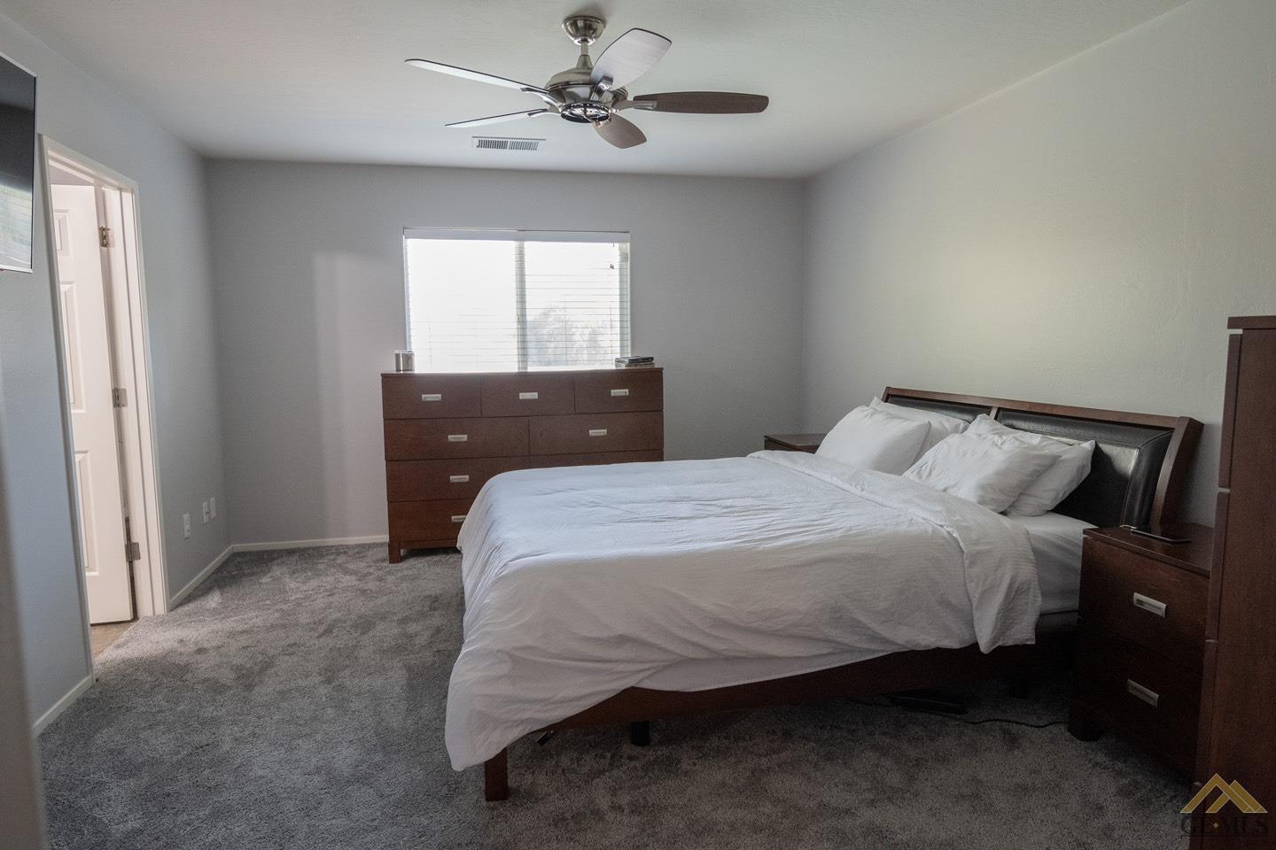 Undisclosed Address Bakersfield, CA 93312 - Photo 10 of 21 a bedroom with a bed and window