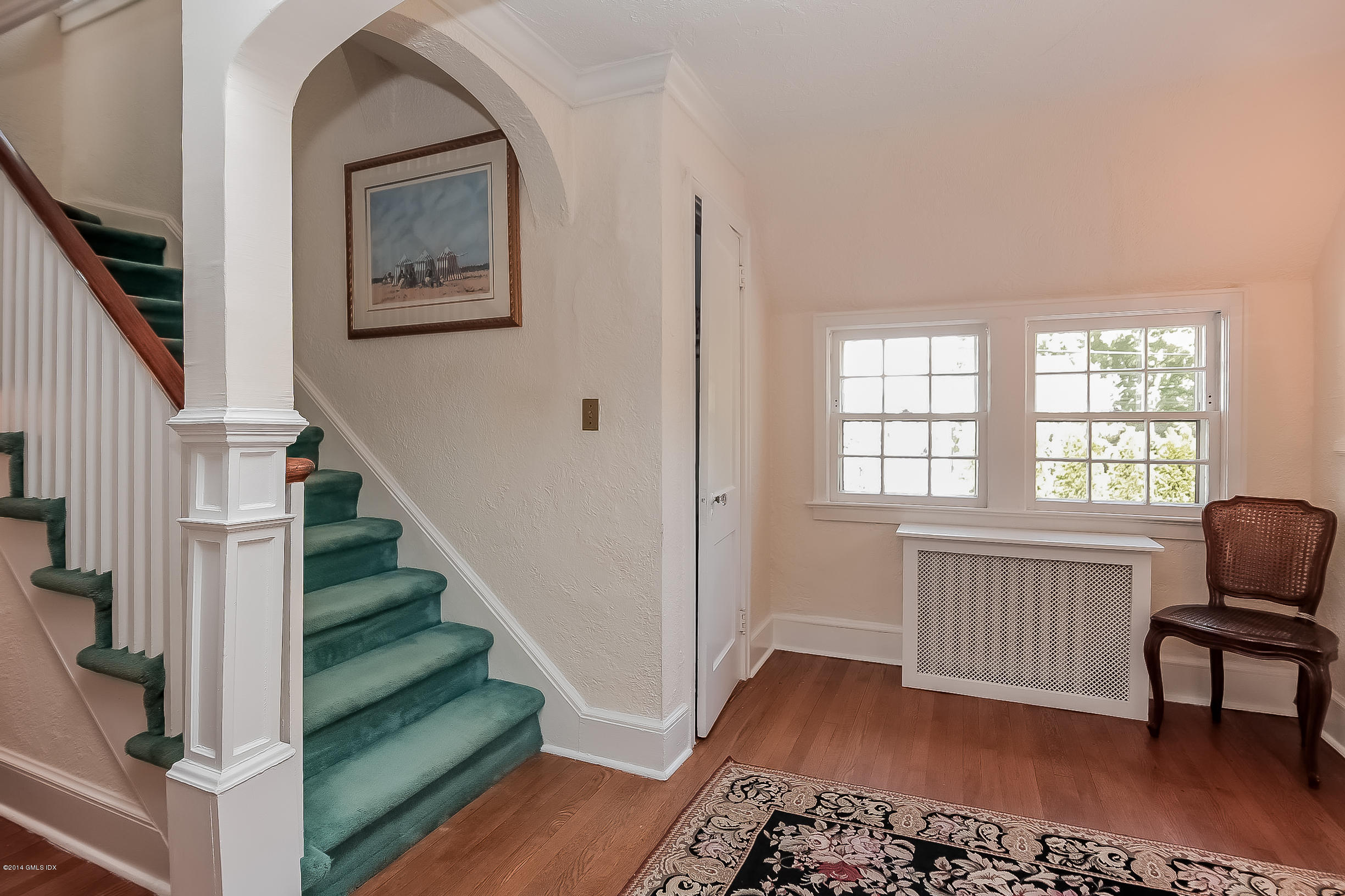 26 Meadow Road Riverside, CT 06878 - Photo 3 of 24 a view of a livingroom with furniture and staircase