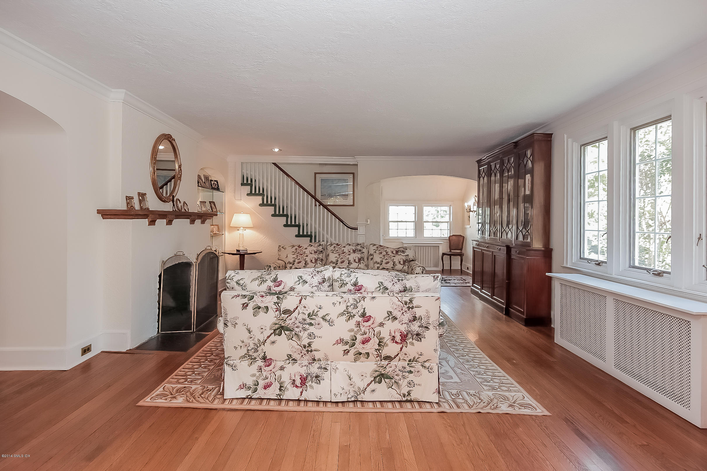 26 Meadow Road Riverside, CT 06878 - Photo 7 of 24 a view of a livingroom with wooden floor windows and a chandelier