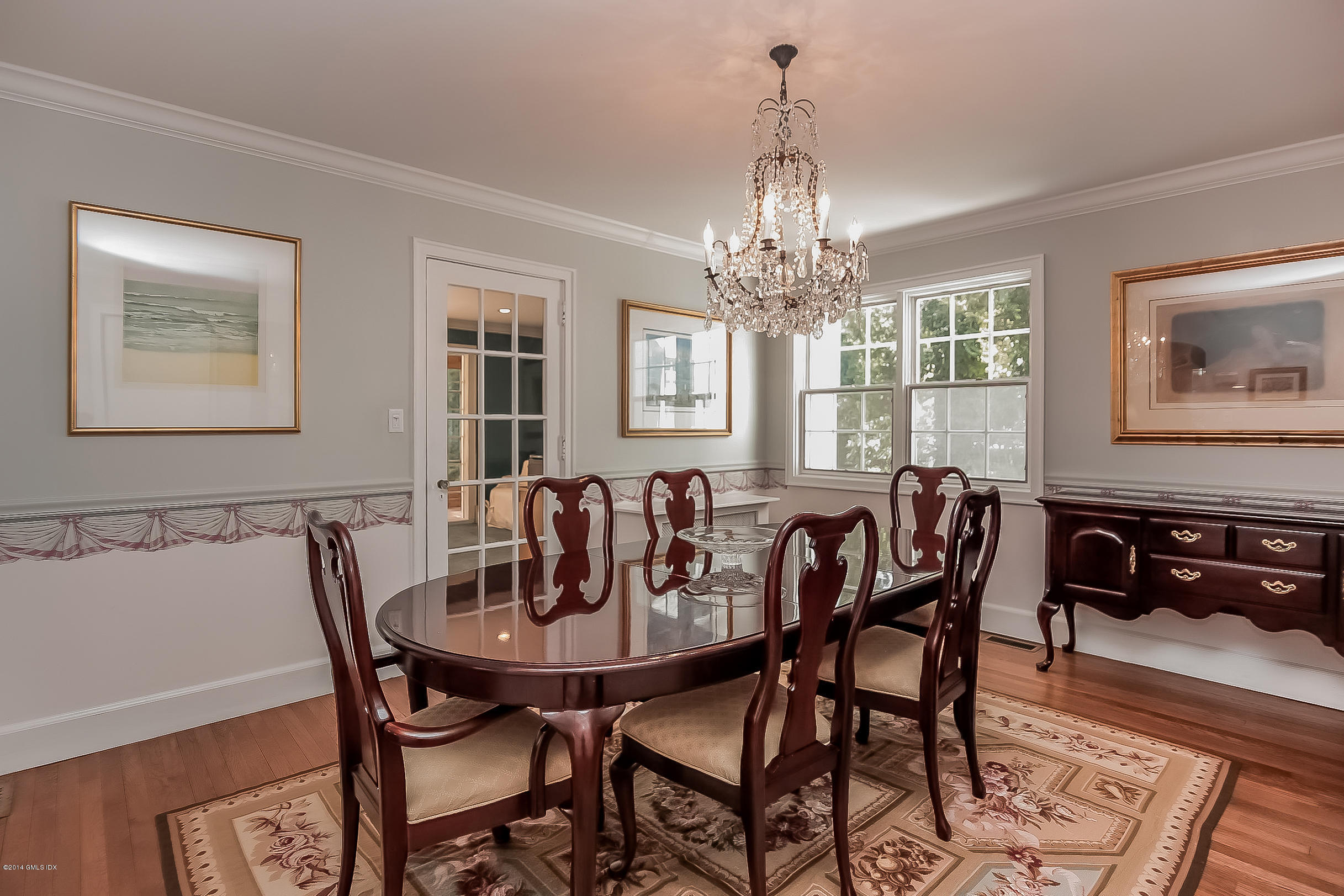 26 Meadow Road Riverside, CT 06878 - Photo 8 of 24 a view of a dining room with furniture and chandelier