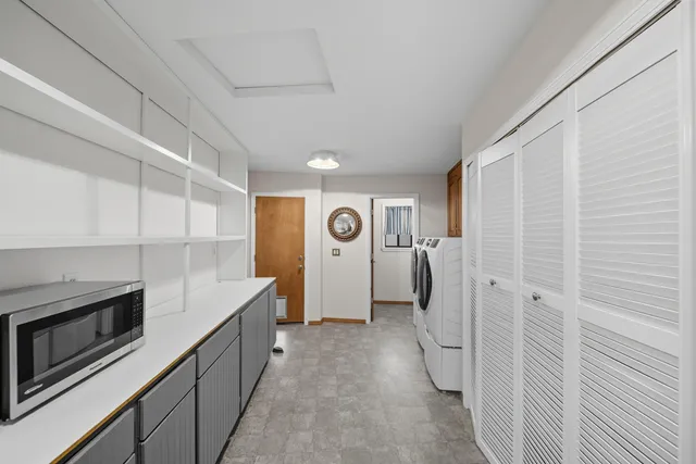 a view of a house with swimming pool and sitting area