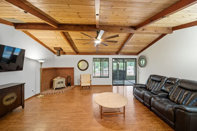 a kitchen with stainless steel appliances granite countertop a stove a refrigerator and a stove top oven