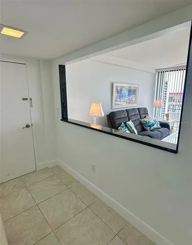 a utility room with stove and cabinets