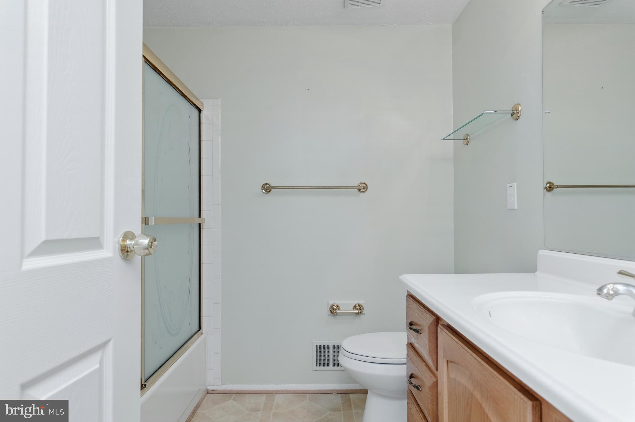 2806 Logway Road Vienna, VA 22181 - Photo 20 of 42 a bathroom with a sink a toilet and shower