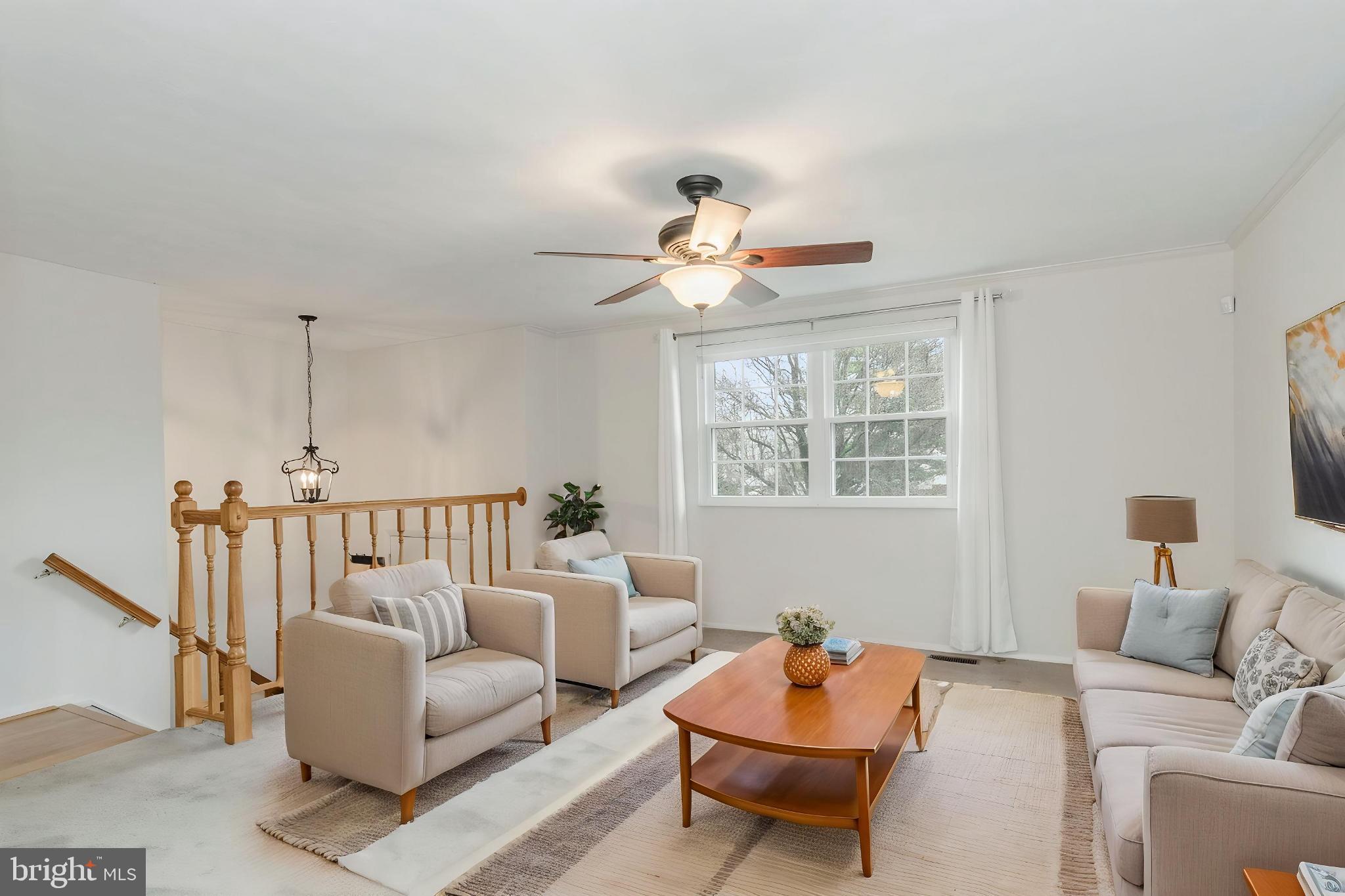 2806 Logway Road Vienna, VA 22181 - Photo 2 of 42 a living room with furniture a rug and a window