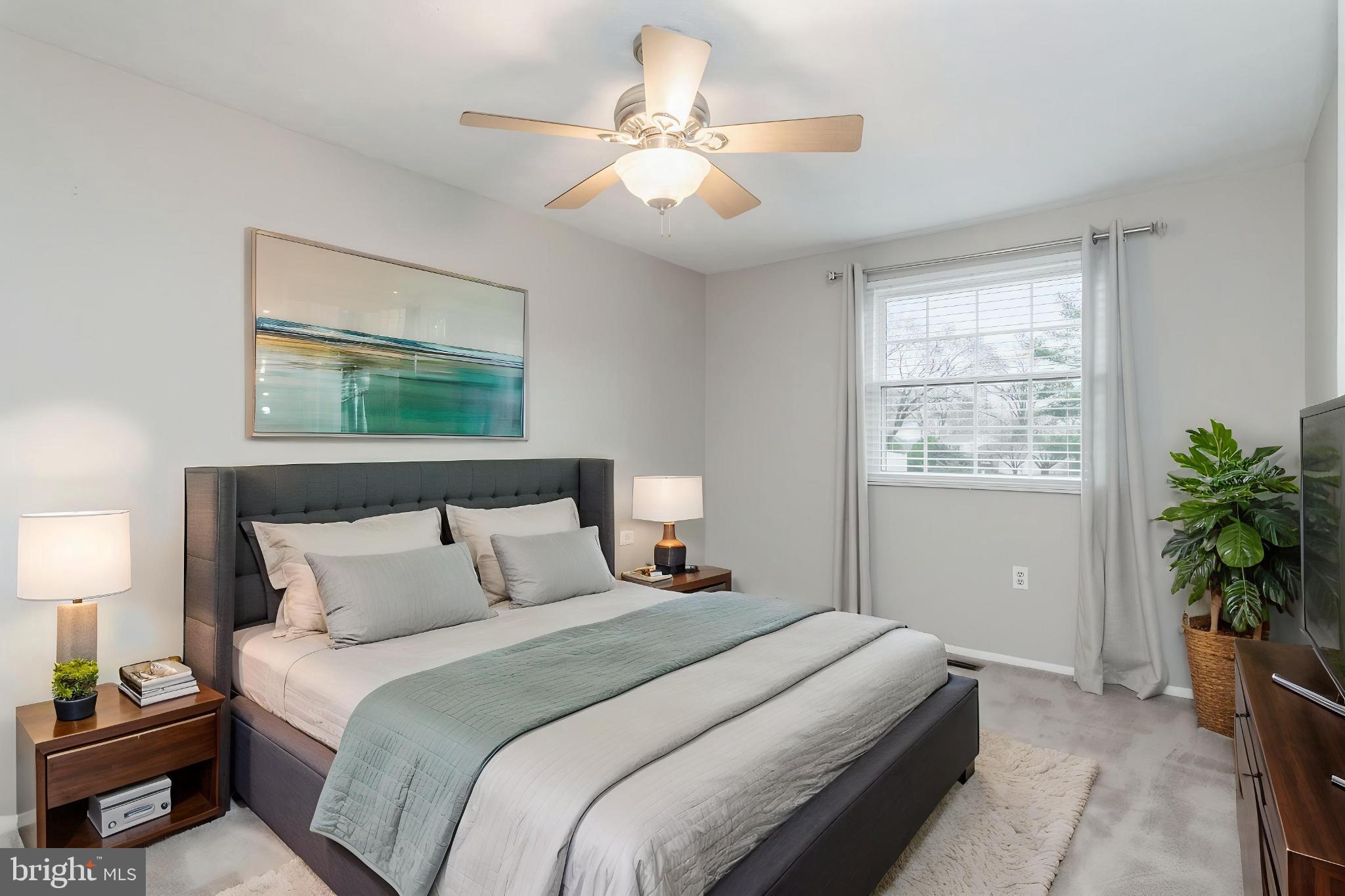 2806 Logway Road Vienna, VA 22181 - Photo 21 of 42 a bedroom with a bed and a chandelier