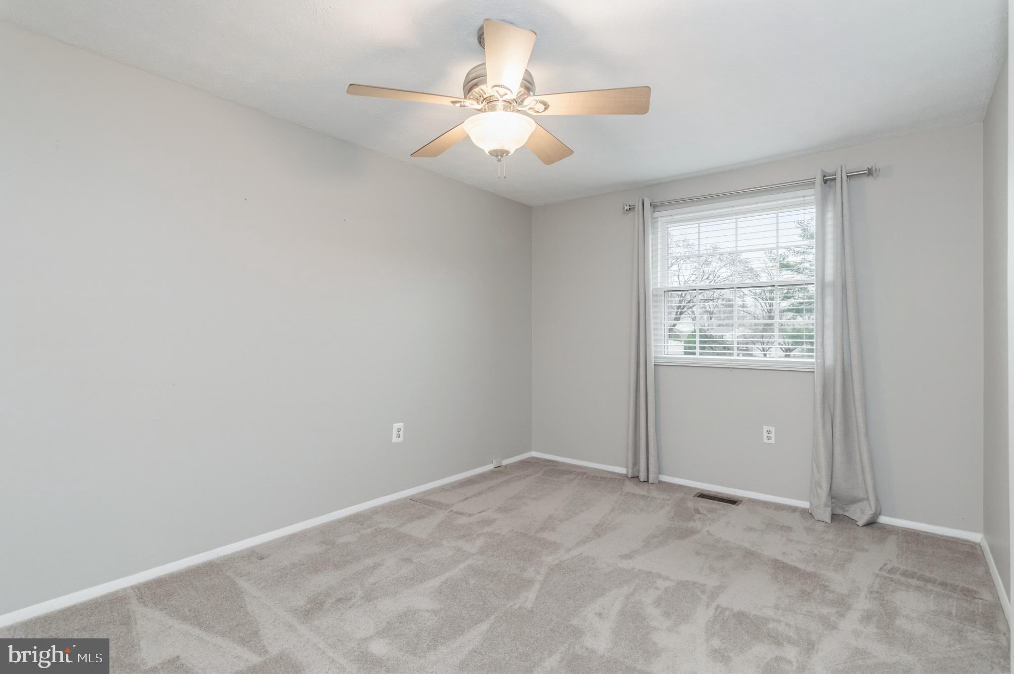 2806 Logway Road Vienna, VA 22181 - Photo 22 of 42 an empty room with windows and fan