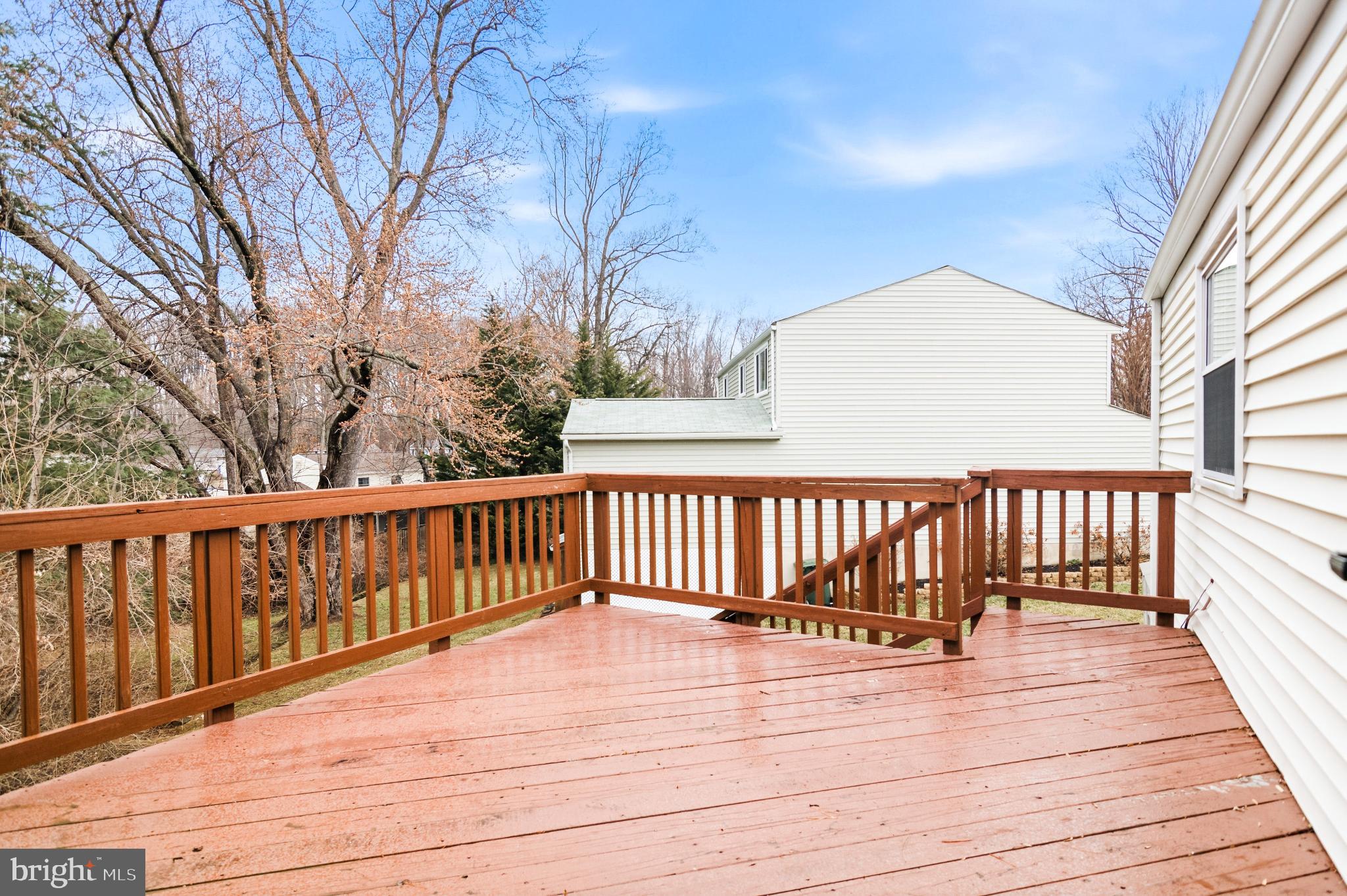 2806 Logway Road Vienna, VA 22181 - Photo 42 of 42 a view of deck with wooden floor and fence and a floor to ceiling window