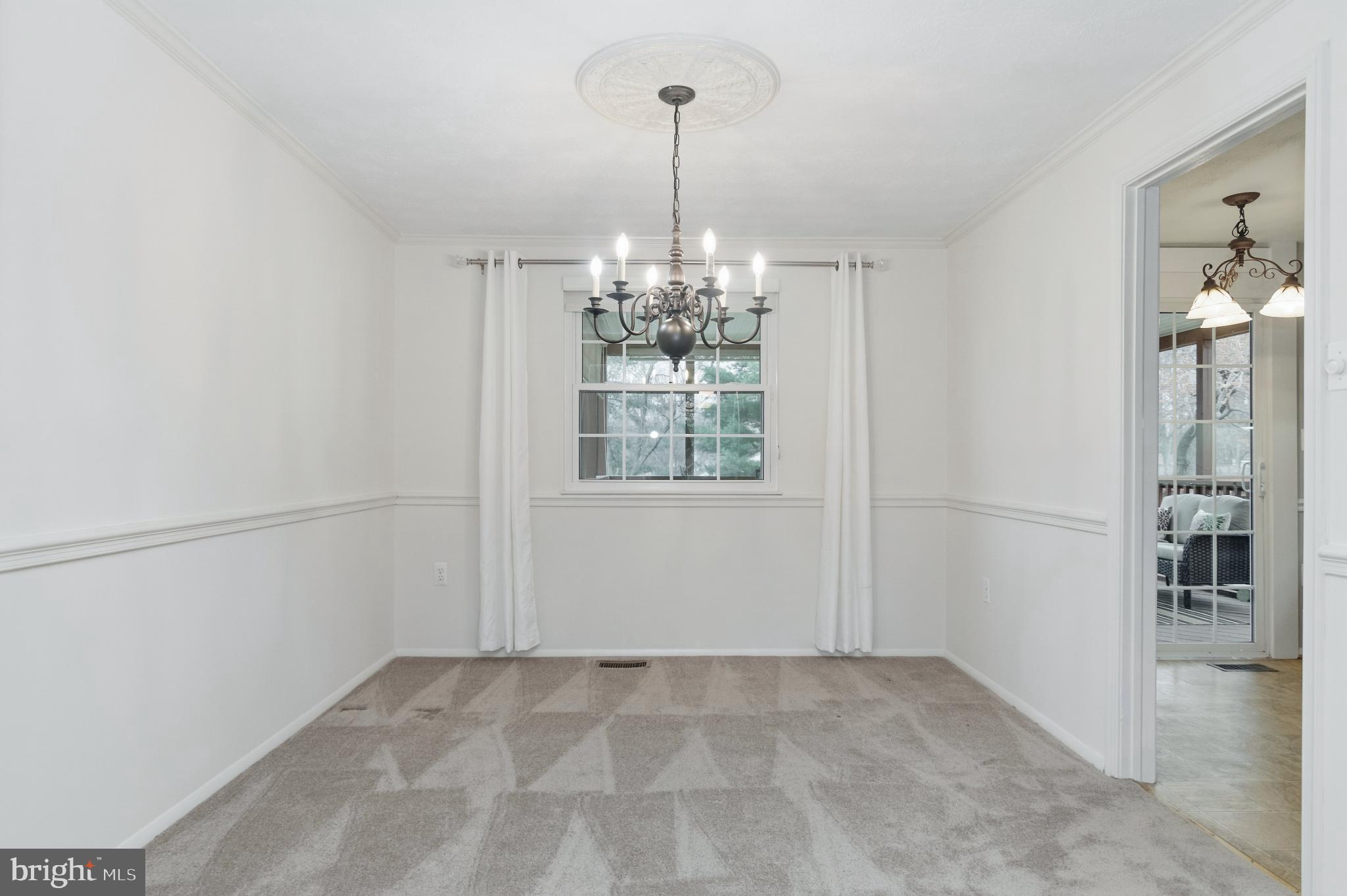 2806 Logway Road Vienna, VA 22181 - Photo 6 of 42 a view of a hallway with windows and chandelier