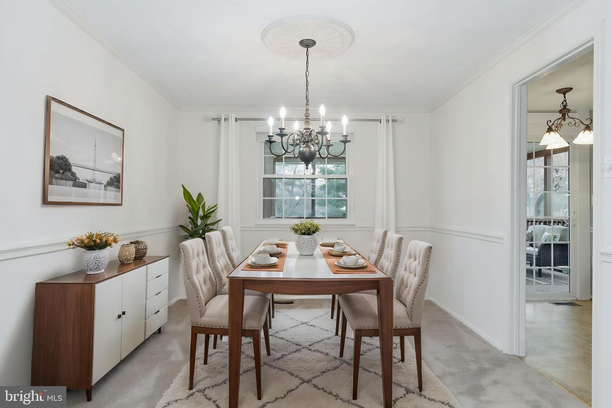 2806 Logway Road Vienna, VA 22181 - Photo 7 of 42 a dining room with furniture a chandelier and window