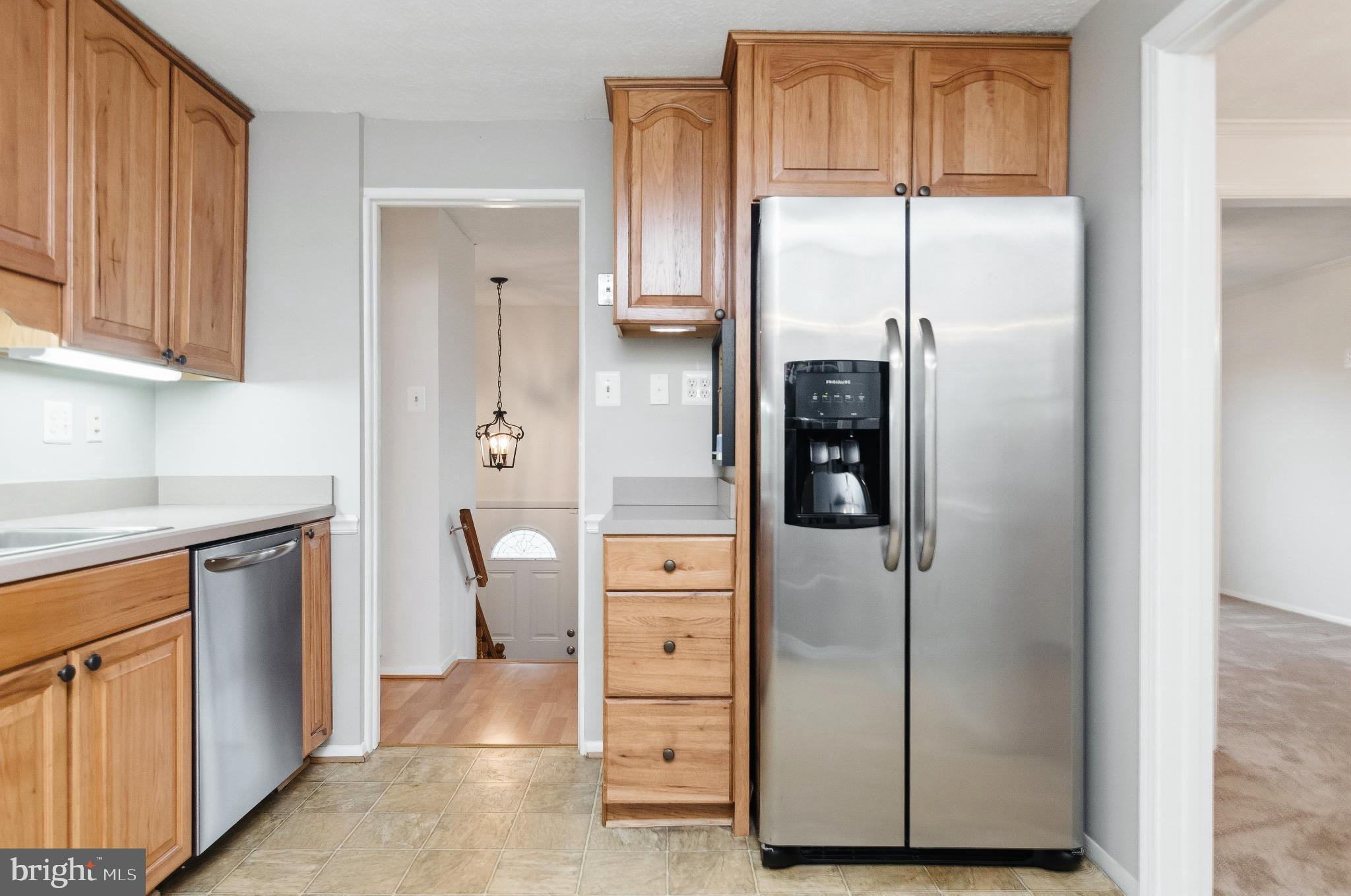 2806 Logway Road Vienna, VA 22181 - Photo 10 of 42 a kitchen with stainless steel appliances granite countertop a refrigerator and a sink
