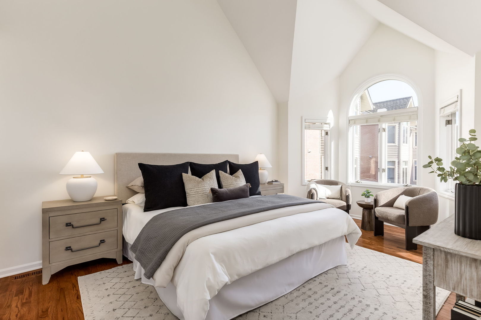 1251 West Fletcher Street, Unit J Chicago, IL 60657 - Photo 11 of 30 a bedroom with bed and large windows