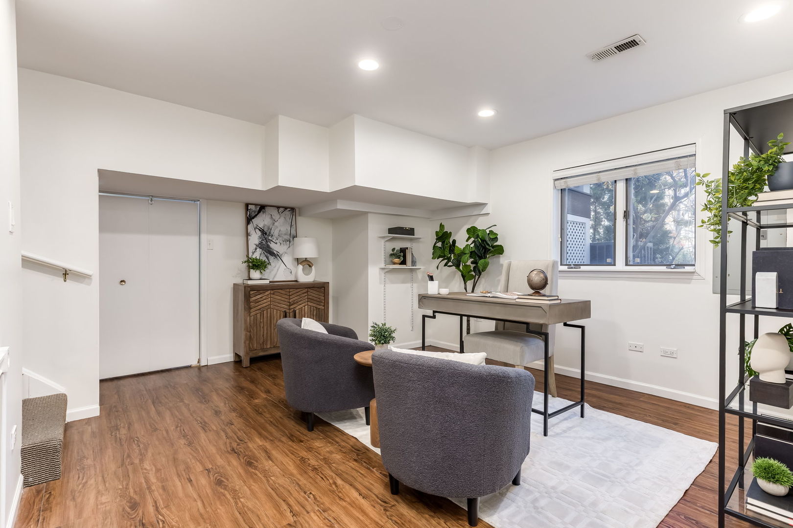 1251 West Fletcher Street, Unit J Chicago, IL 60657 - Photo 21 of 30 a living room with furniture and a wooden floor