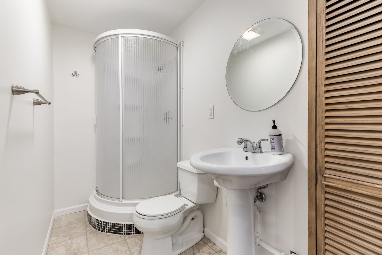 1251 West Fletcher Street, Unit J Chicago, IL 60657 - Photo 25 of 30 a bathroom with a sink toilet and shower