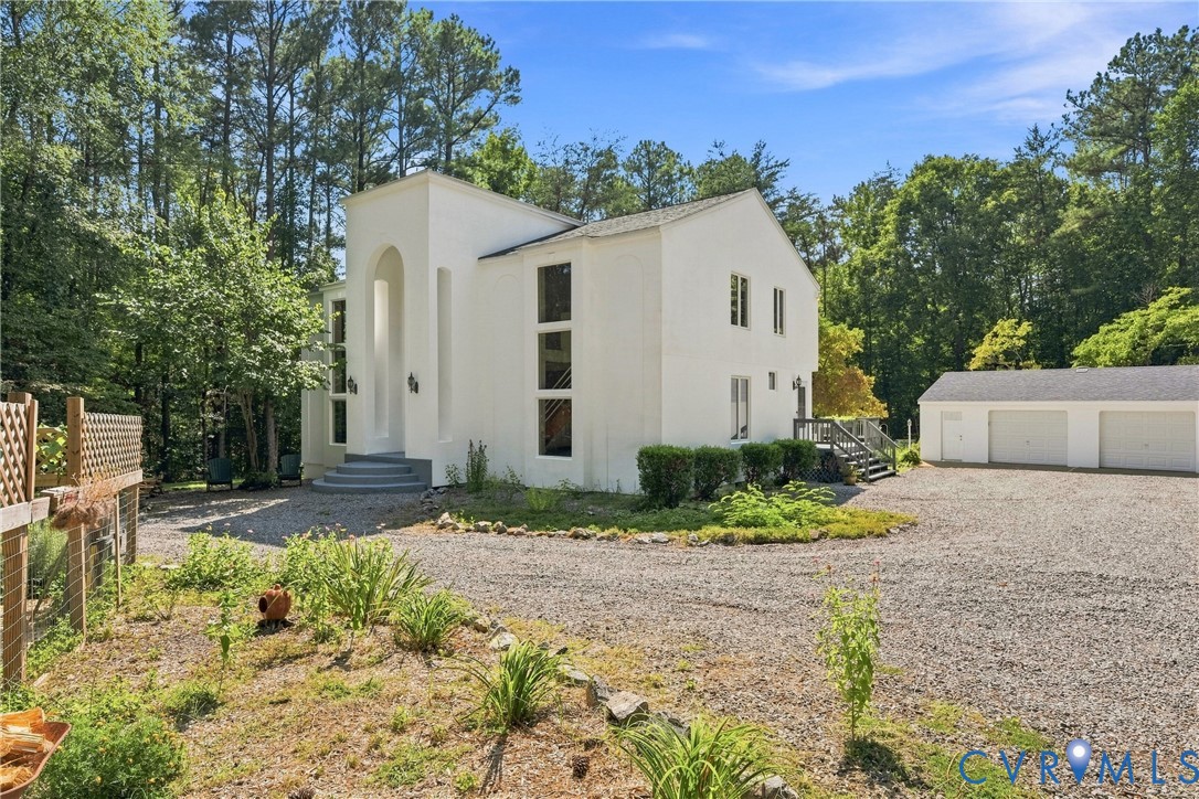 17089 Goshen Road Montpelier, VA 23192 - Photo 63 of 64 White stucco exterior with an arched entry