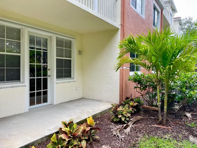 a view of a house with a flower garden