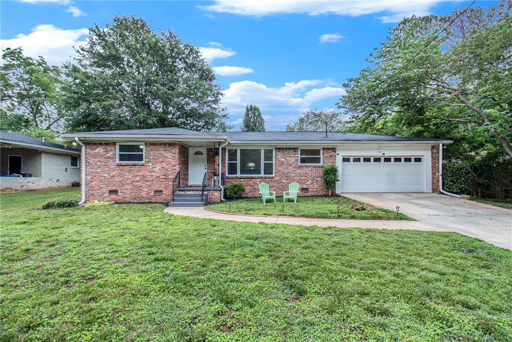 3217 Betty Circle Decatur, GA 30032 - Photo 1 of 1 a front view of a house with a yard and garage