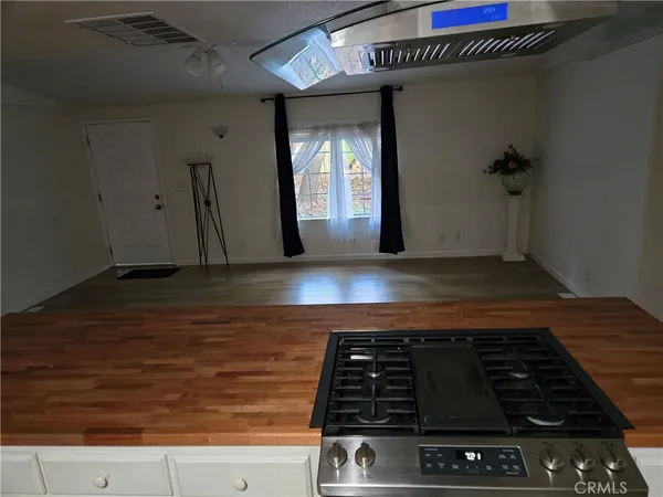 a stove top oven sitting inside of a kitchen
