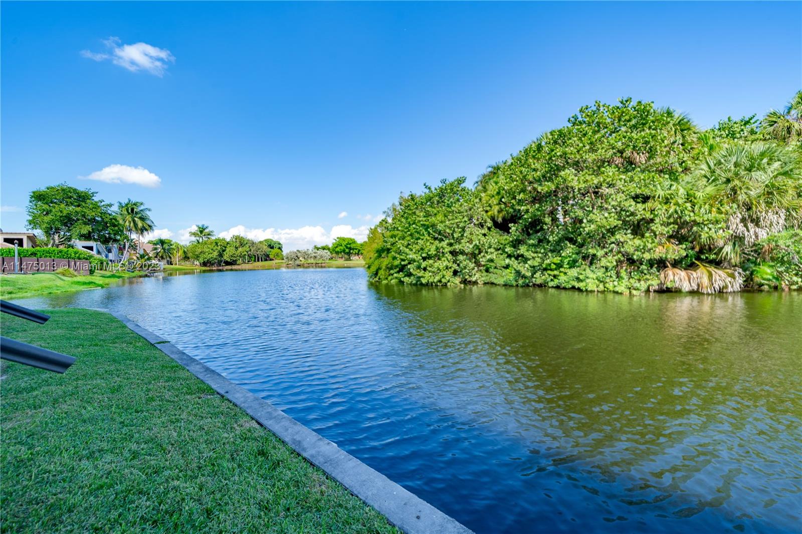 950 Mockingbird Lane, Unit 609A Plantation, FL 33324 - Photo 12 of 64 a view of a lake from a yard