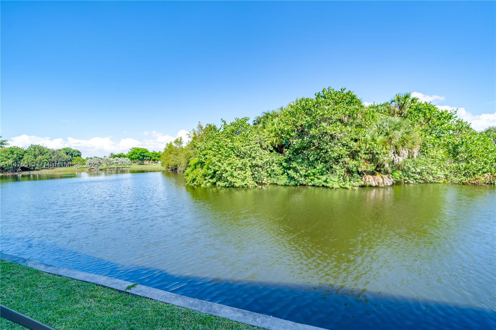 950 Mockingbird Lane, Unit 609A Plantation, FL 33324 - Photo 14 of 64 a view of a lake from a yard
