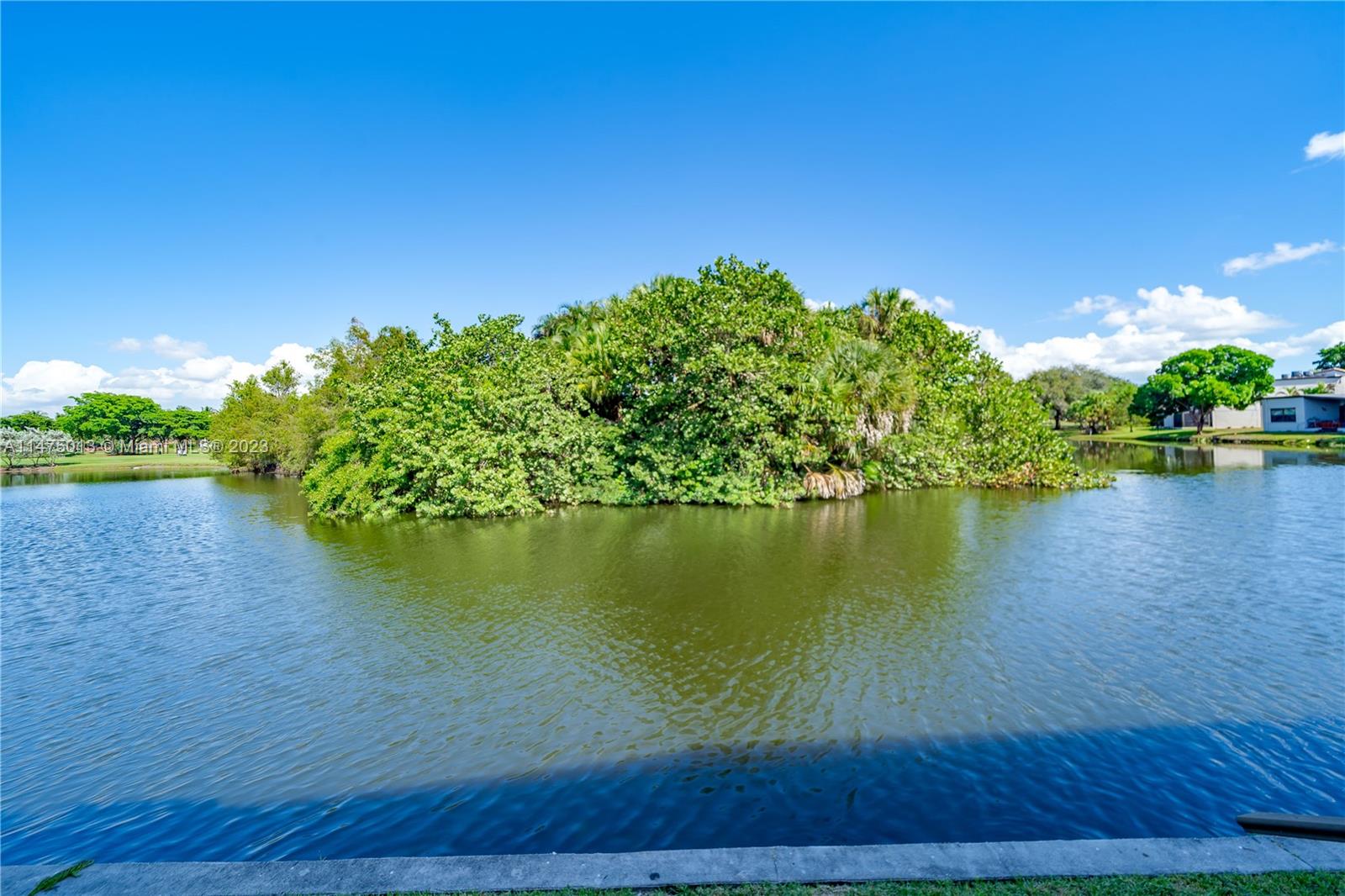 950 Mockingbird Lane, Unit 609A Plantation, FL 33324 - Photo 16 of 64 a view of a lake with a big yard