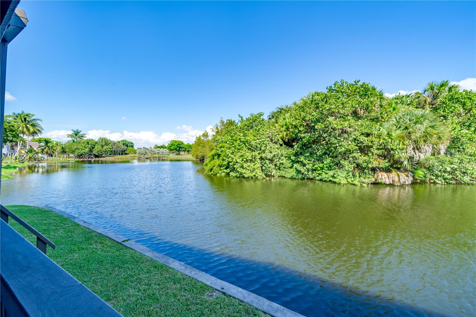 950 Mockingbird Lane, Unit 609A Plantation, FL 33324 - Photo 17 of 64 a view of a lake with a big yard
