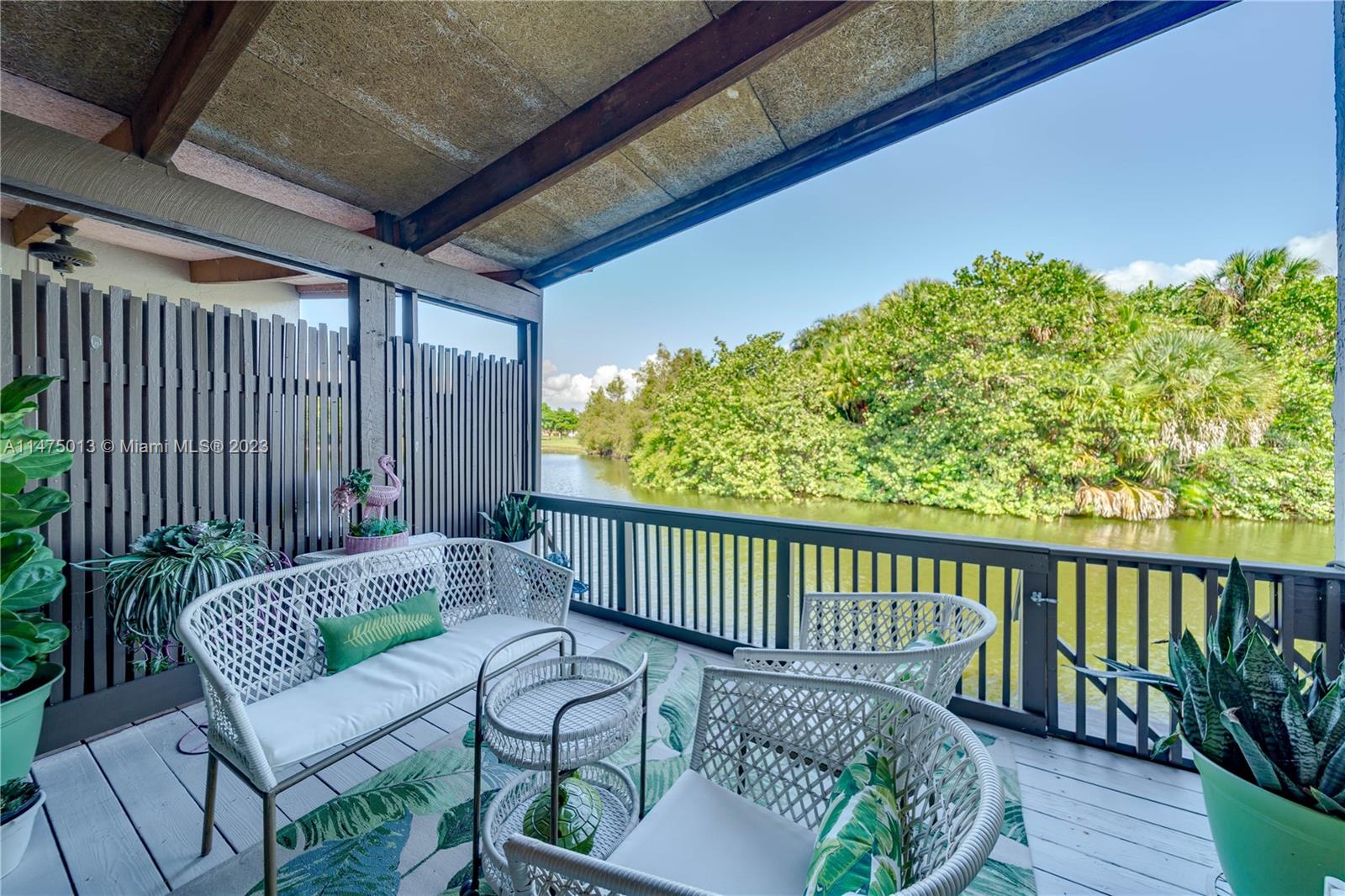 950 Mockingbird Lane, Unit 609A Plantation, FL 33324 - Photo 20 of 64 a view of a chair in wooden deck