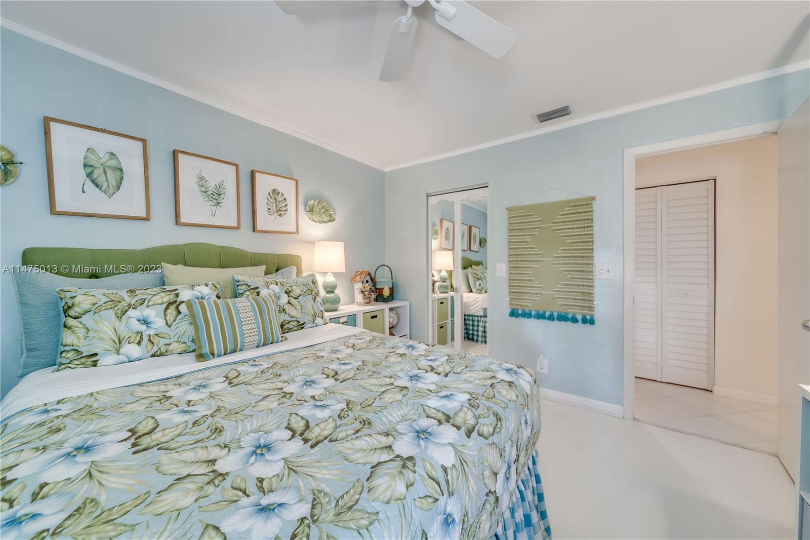 950 Mockingbird Lane, Unit 609A Plantation, FL 33324 - Photo 23 of 64 a bedroom with a bed and a table