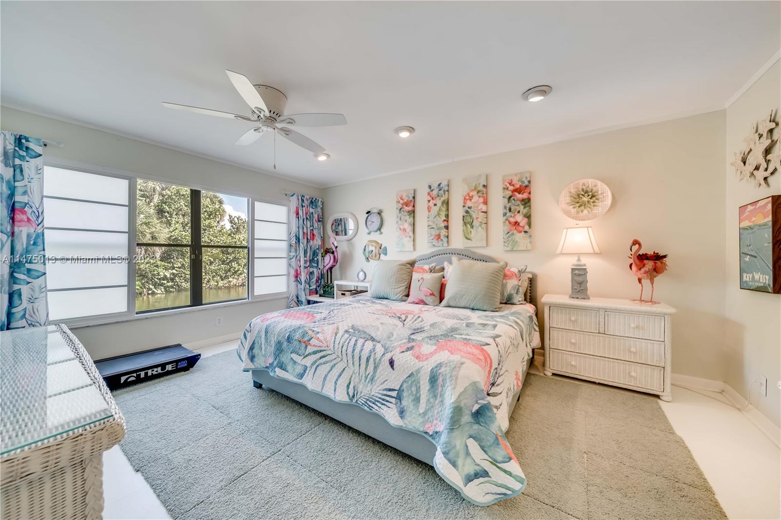 950 Mockingbird Lane, Unit 609A Plantation, FL 33324 - Photo 28 of 64 a bedroom with a bed and a large window