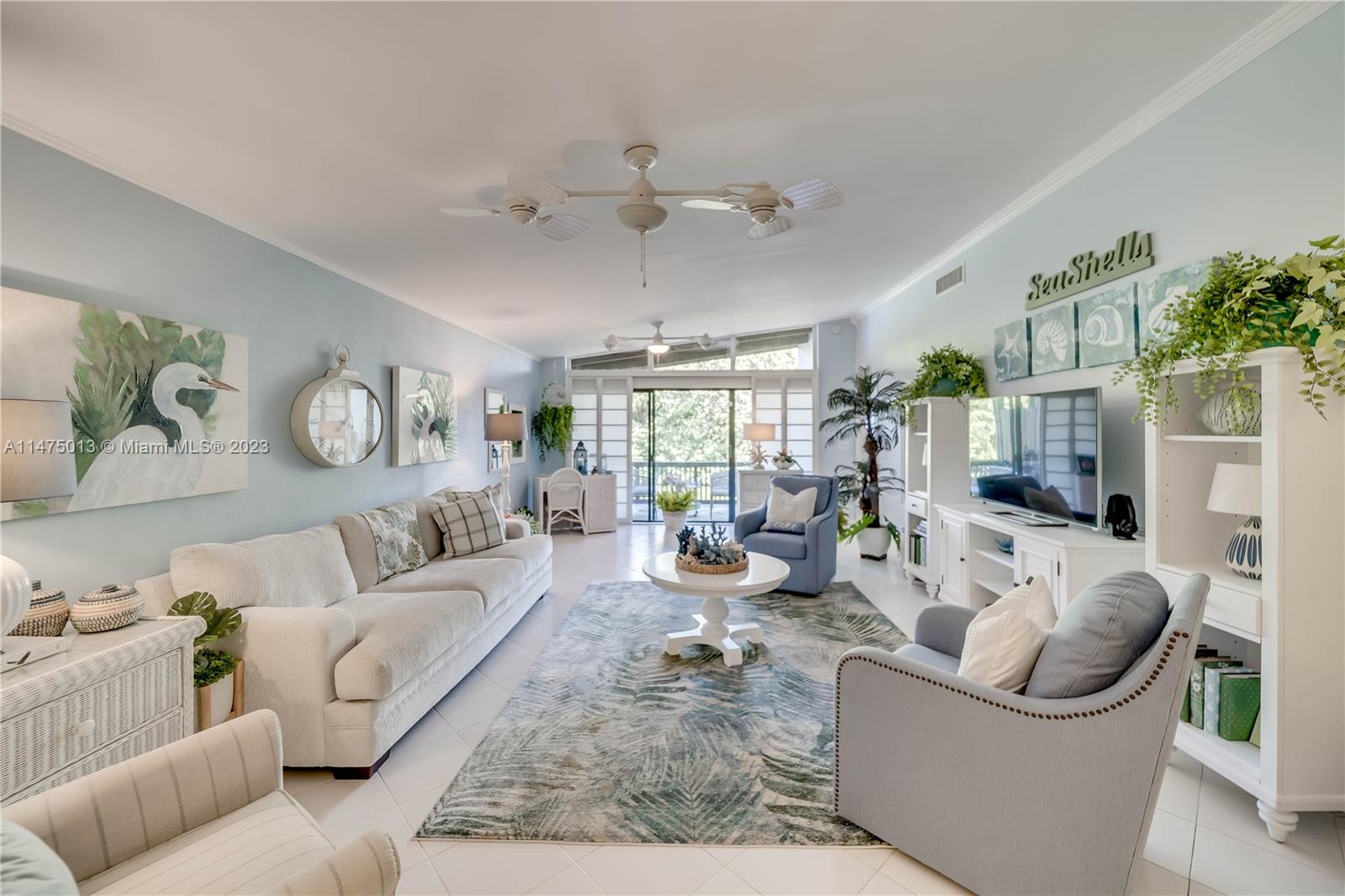 950 Mockingbird Lane, Unit 609A Plantation, FL 33324 - Photo 3 of 64 a living room with furniture and a large window