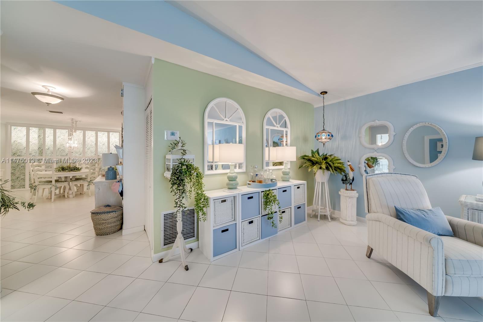 950 Mockingbird Lane, Unit 609A Plantation, FL 33324 - Photo 32 of 64 a living room with furniture and a potted plant