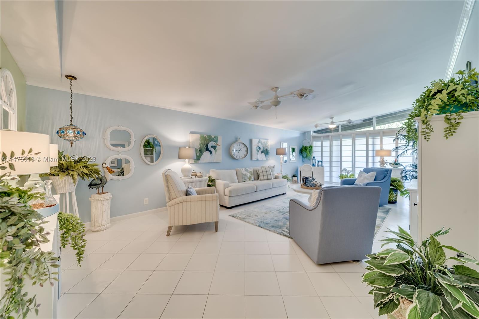 950 Mockingbird Lane, Unit 609A Plantation, FL 33324 - Photo 34 of 64 a living room with furniture and a potted plant