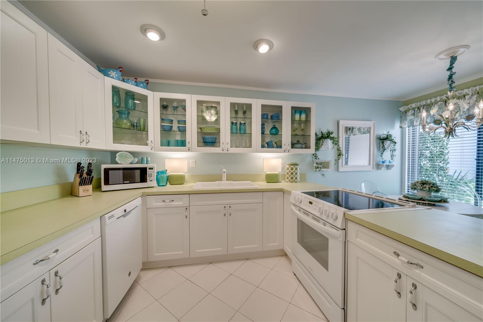 950 Mockingbird Lane, Unit 609A Plantation, FL 33324 - Photo 38 of 64 a kitchen that has a sink and cabinets