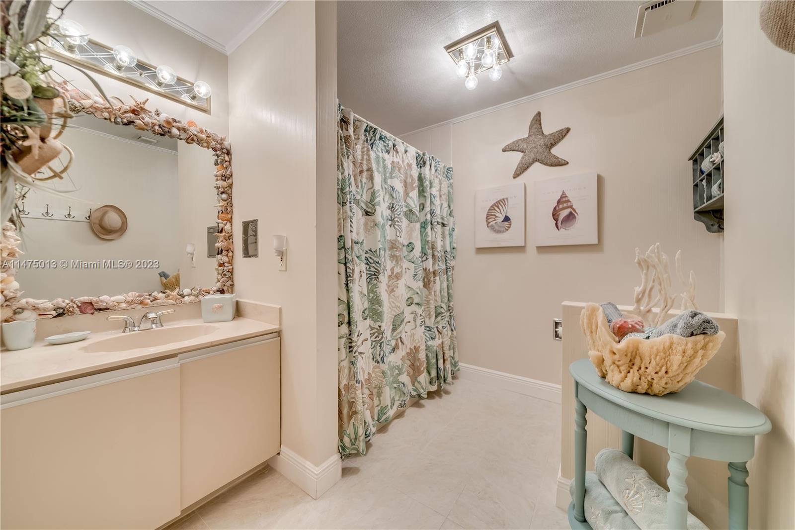 950 Mockingbird Lane, Unit 609A Plantation, FL 33324 - Photo 46 of 64 a bathroom with a sink and a mirror