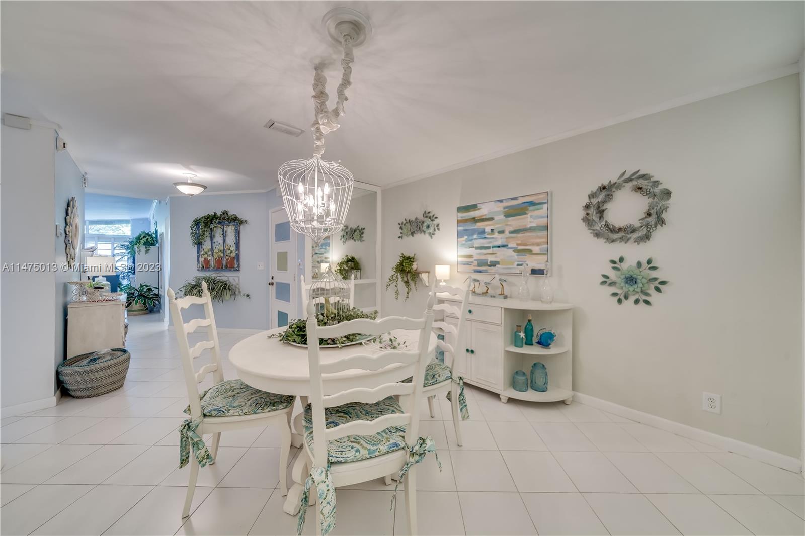 950 Mockingbird Lane, Unit 609A Plantation, FL 33324 - Photo 48 of 64 a view of a dining room with furniture and chandelier