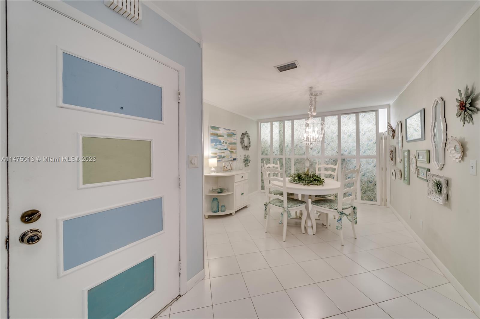 950 Mockingbird Lane, Unit 609A Plantation, FL 33324 - Photo 49 of 64 a dining room with furniture and a large window