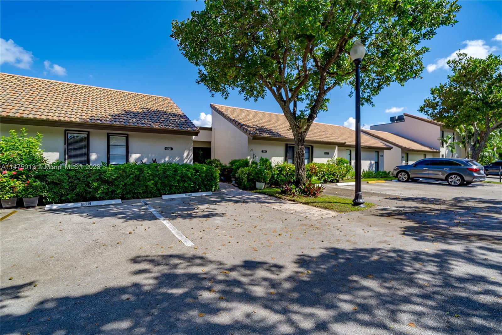 950 Mockingbird Lane, Unit 609A Plantation, FL 33324 - Photo 52 of 64 a house with a tree in front of it