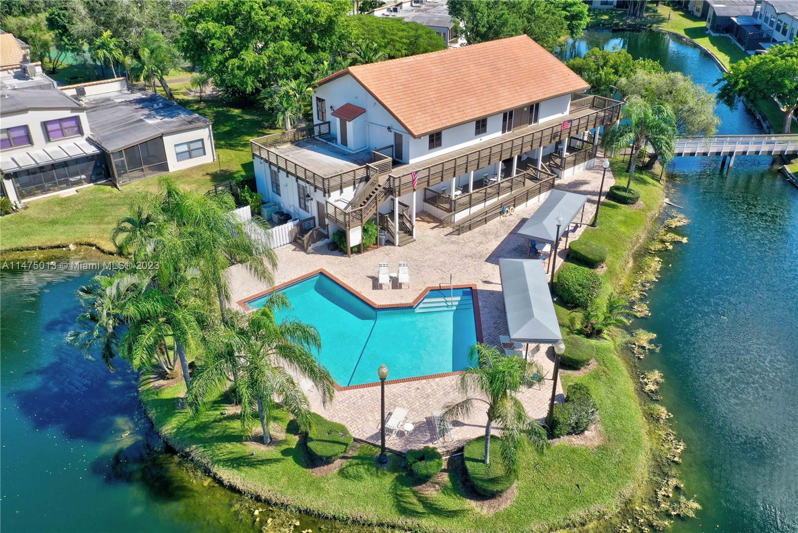 950 Mockingbird Lane, Unit 609A Plantation, FL 33324 - Photo 55 of 64 an aerial view of a house with outdoor space pool seating area and yard