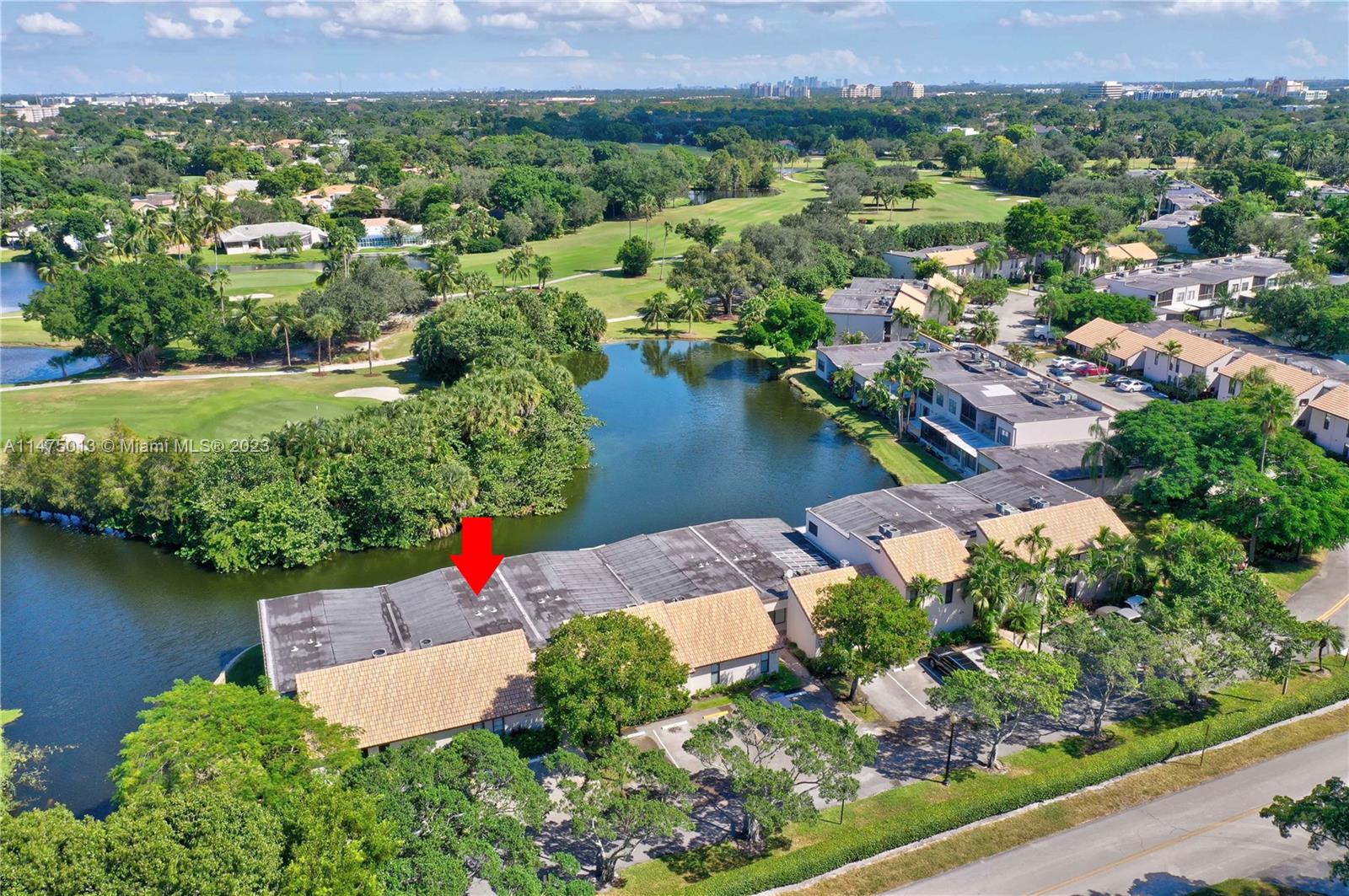 950 Mockingbird Lane, Unit 609A Plantation, FL 33324 - Photo 61 of 64 an aerial view of a house with a garden and lake view
