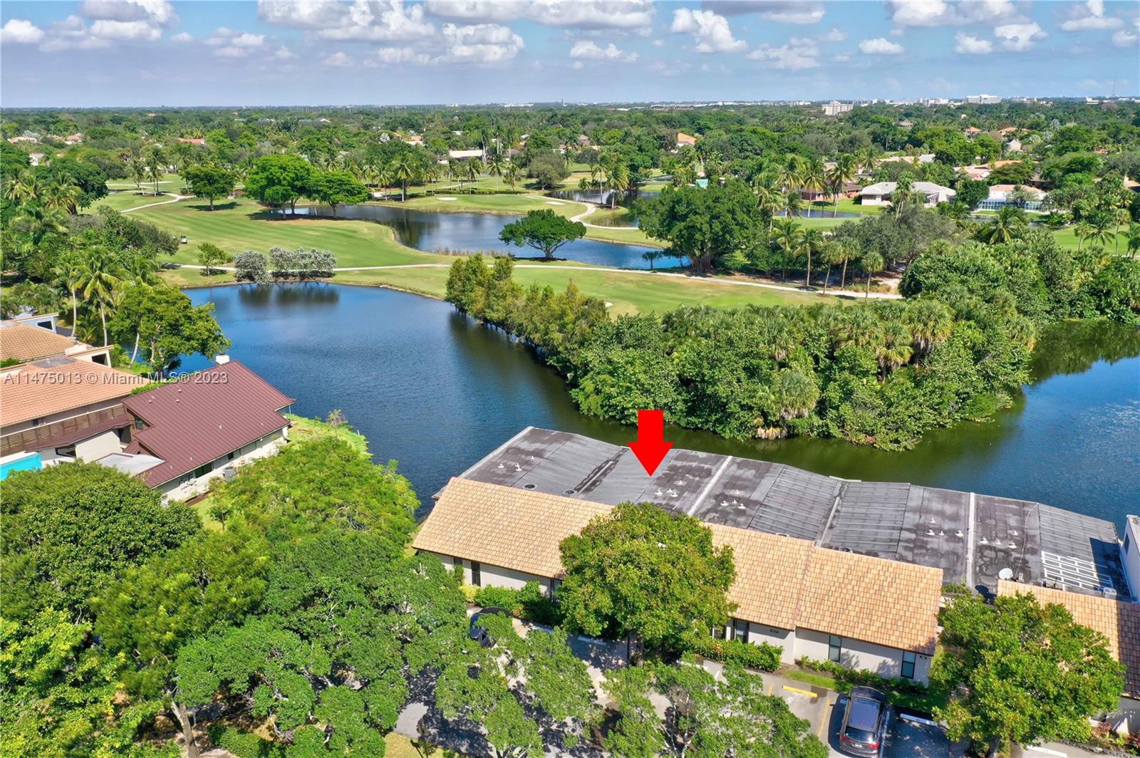 950 Mockingbird Lane, Unit 609A Plantation, FL 33324 - Photo 63 of 64 an aerial view of a house with a yard and lake view